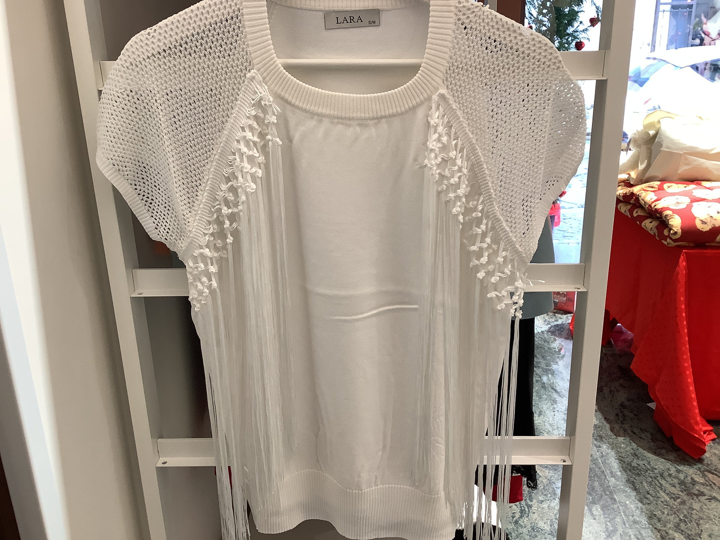 Maglia con nappine laterali